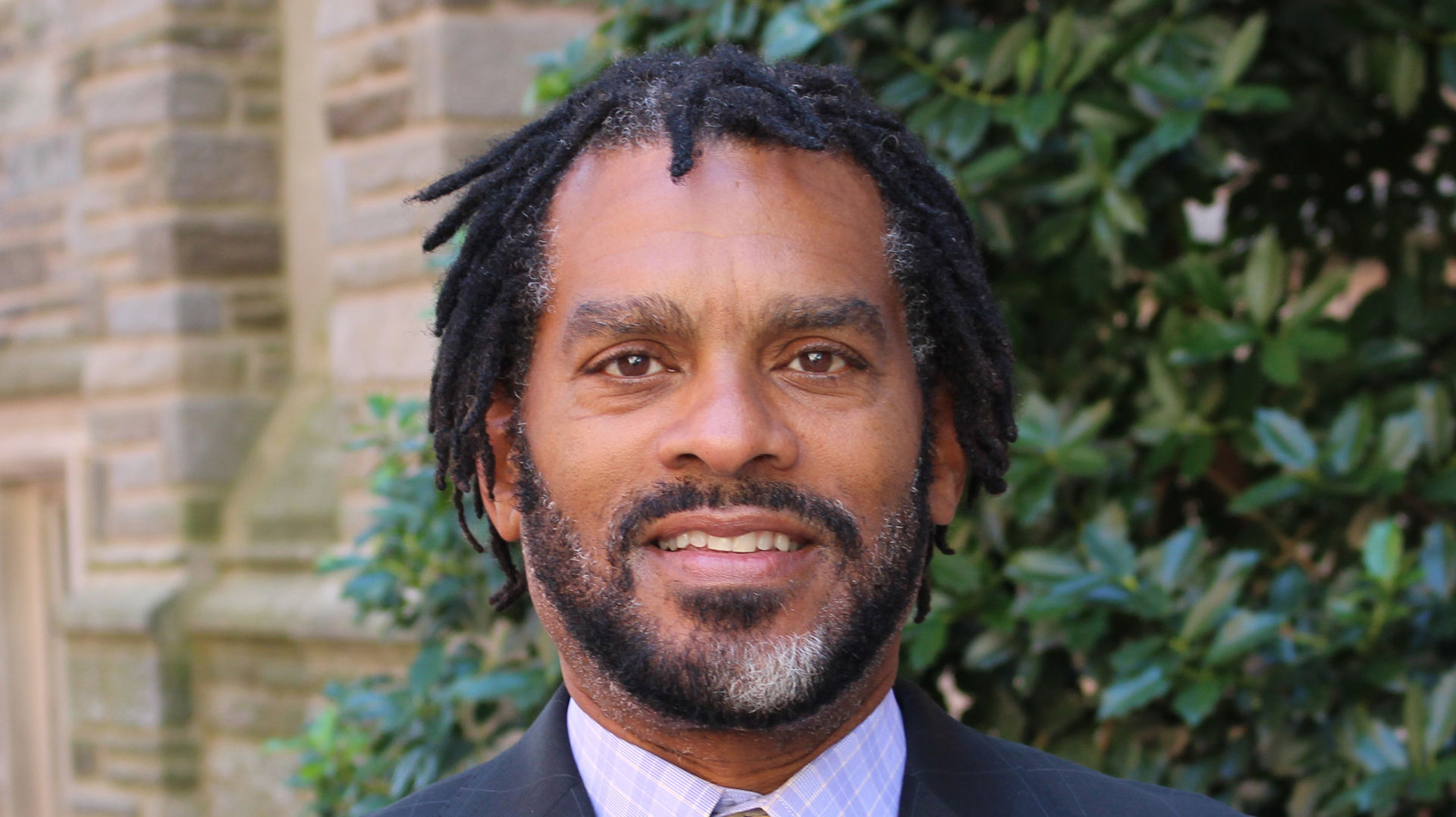  Image of Donald P. Harris standing in front of a tree.