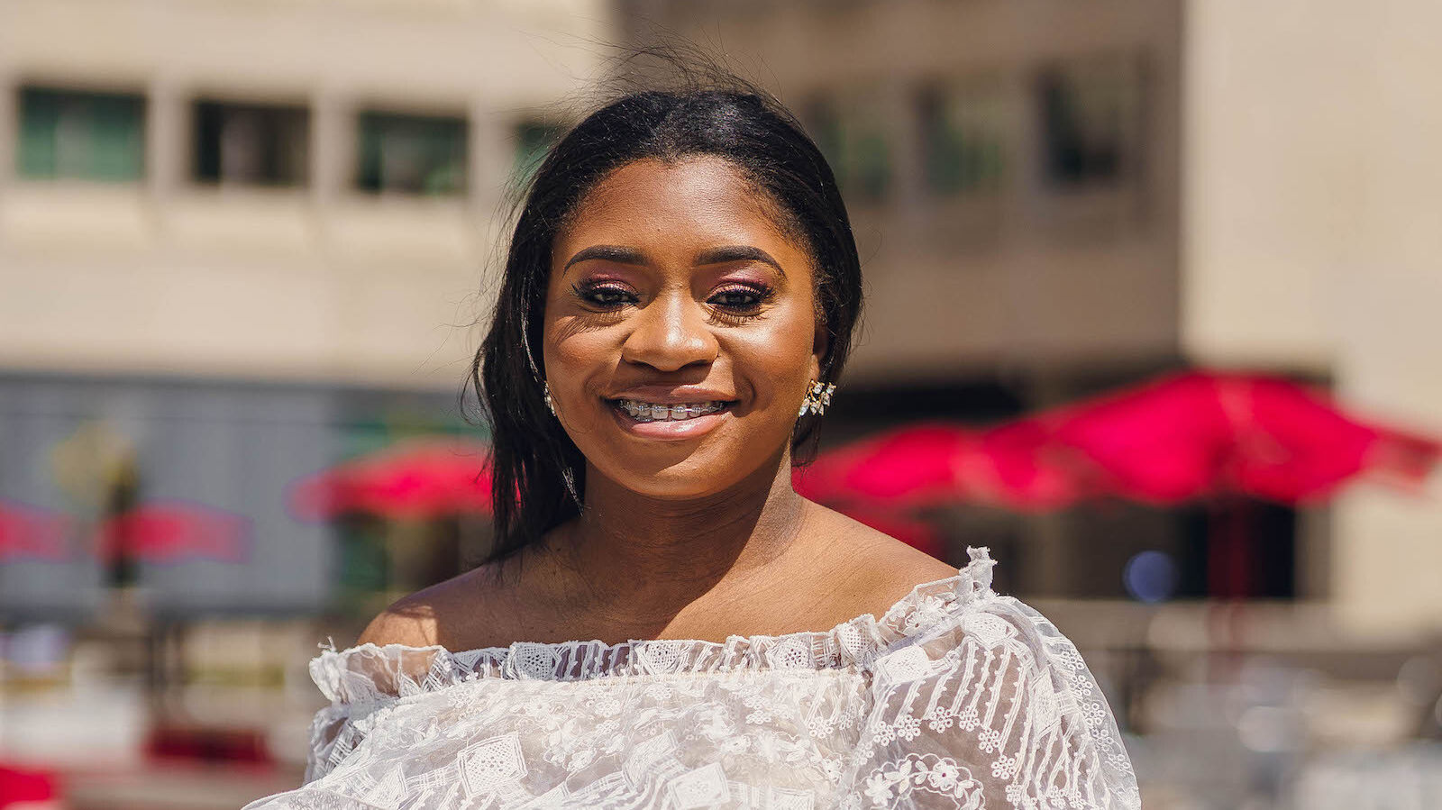 Image of Alvira Bonsu in a dress outside