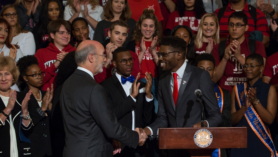 Gov. Tom Wolf shakes hands with student body President Tyrell Mann-Barnes