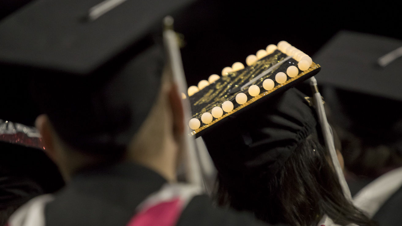 a view of graduates with caps decorated