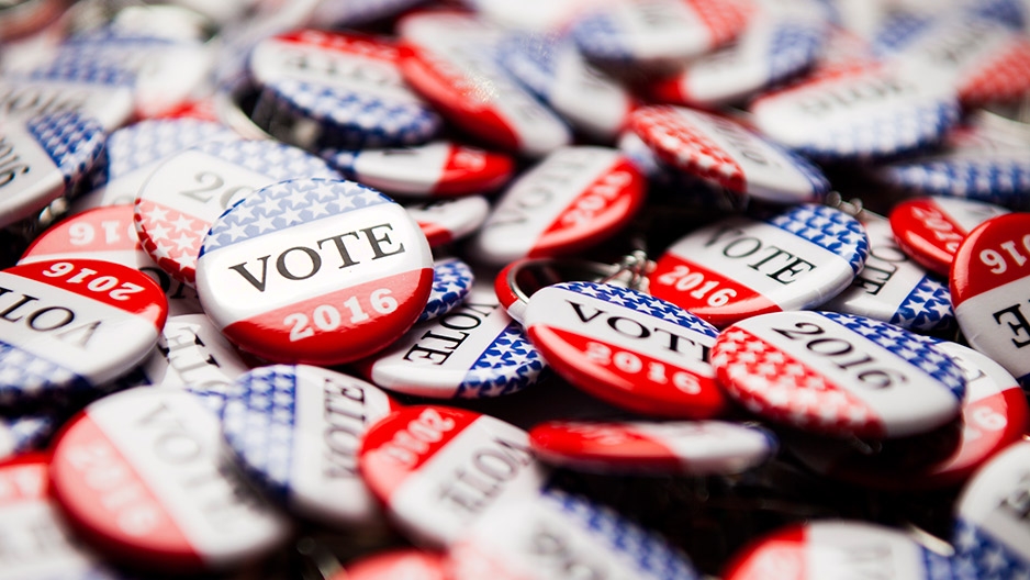 A pile of red, white and blue buttons. 