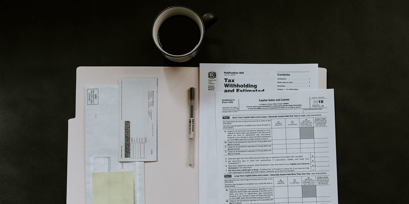 Tax return paperwork pictured.