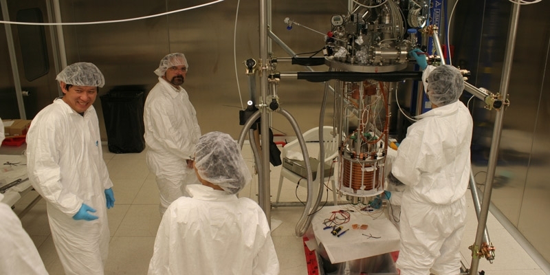 Physicist Jeff Martoff and fellow researchers in a lab