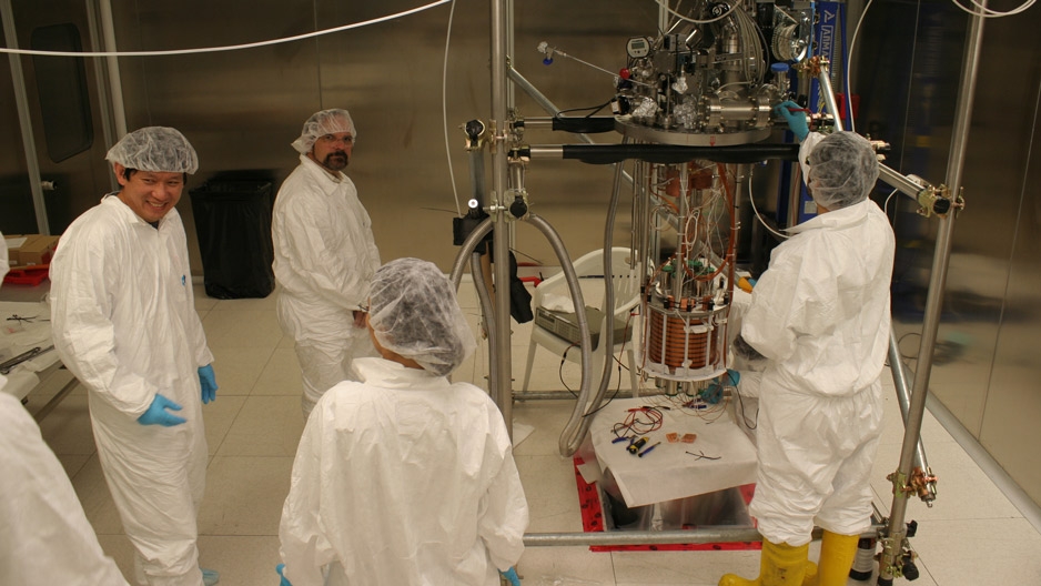 Physicist Jeff Martoff and fellow researchers in a lab