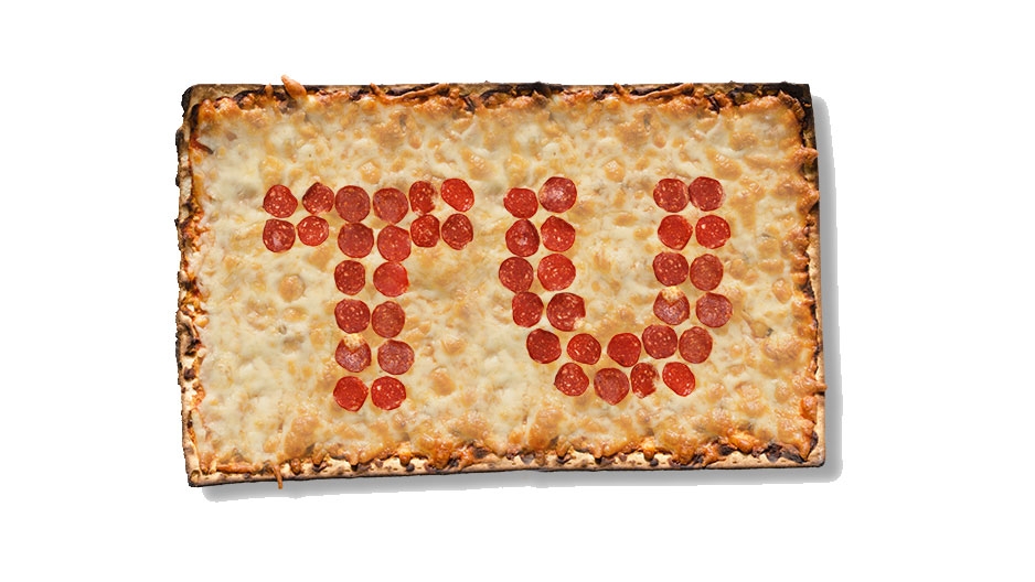 A square pizza with “TU” in pepperoni.