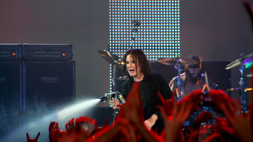 Ozzy Osbourne spraying crowd with a hose 