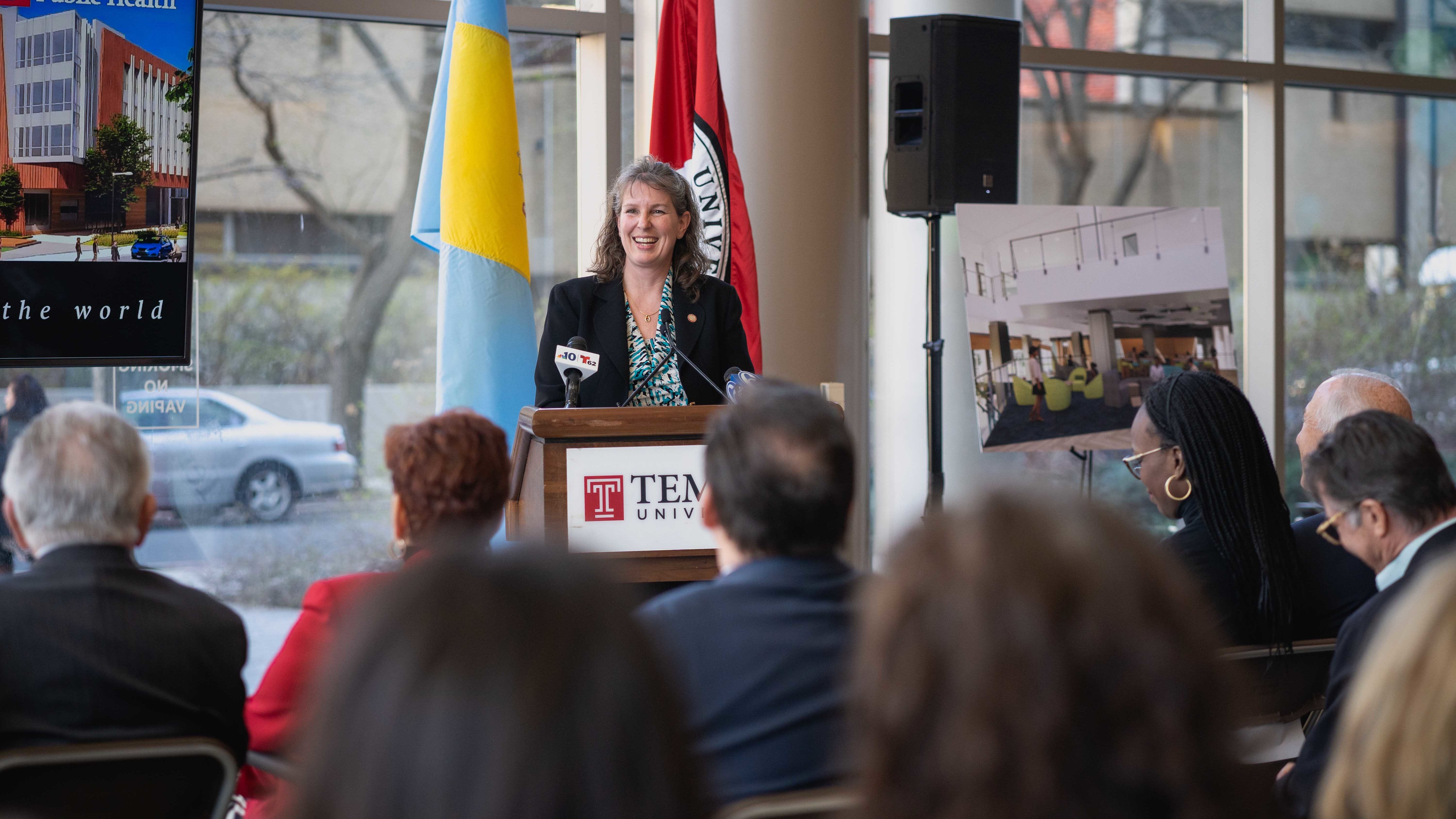 Jennifer Ibrahim standing at a podium