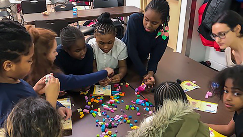 Children work together during the Norris Homes program