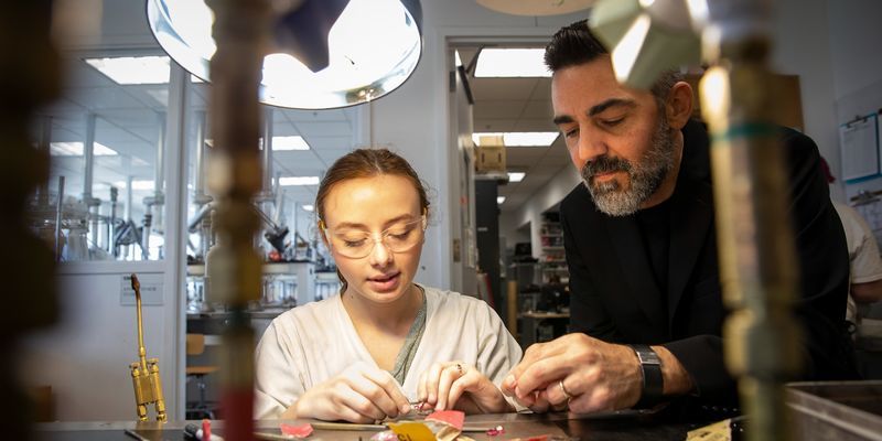 Image of MJCC program head Doug Bucci working with a student.