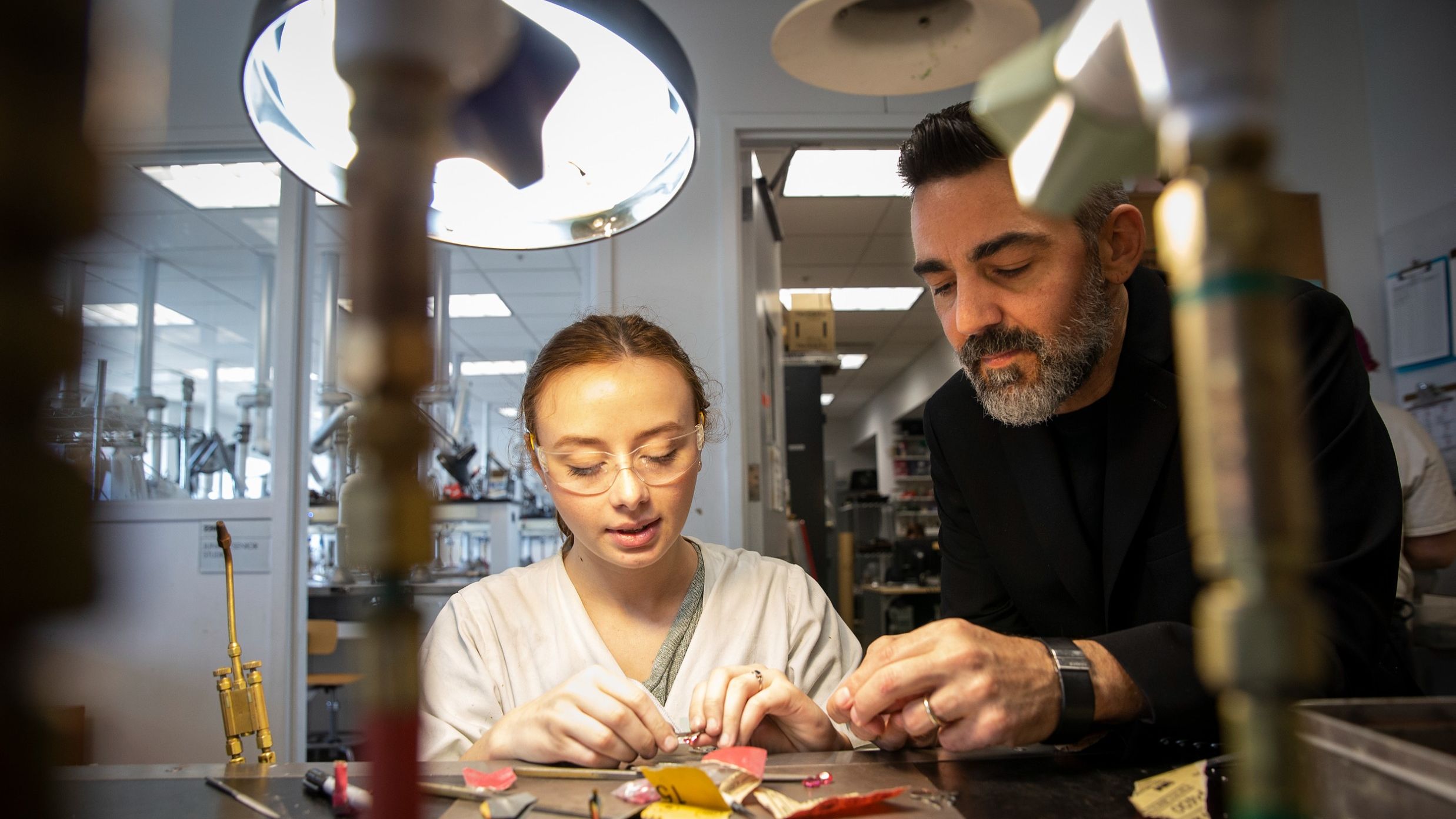 Image of MJCC program head Doug Bucci working with a student.