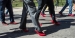 Men walking around Main Campus in red high heels.
