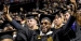 A graduate celebrating at Temple’s Commencement