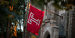 A red flag with a Temple "T" affixed to Sullivan Hall