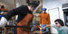 Image of Jessica Jane Julius and two helpers working with molten glass.