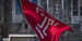 Image of the cherry and white Temple ‘T’ flag outside of Sullivan Hall on Main Campus.