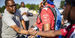 Police officer and student shake hands