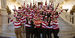 Temple students wearing red and white shirts took a group photo on the steps of the Capitol’s main rotunda. 