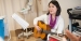 A woman with a guitar in a hospital room