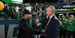 Image of Temple alum greeting Philadelphia Eagles president inside a stadium.  