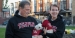 Gene and Cathy Salkind posing in Philadelphia with two small dogs.