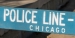 A wooden, blue police line barricade in Chicago.