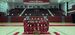  Image of Temple’s dance team wearing cherry and white posing in front of trophies.  