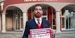 Soren holds sign saying “#TempleMade for US-Japan-ROK Trilateral Relationship”