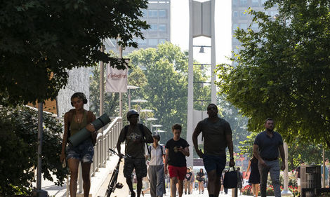 Students walking with Bell Tower in the background