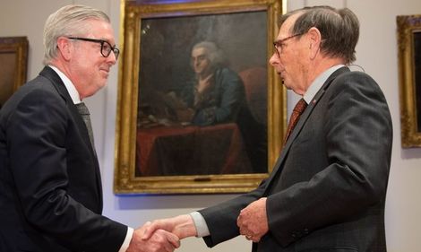 A picture of President John Fry being inducted into the American Philosophical Society.