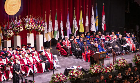 President Fry speaking at podium during Commencement
