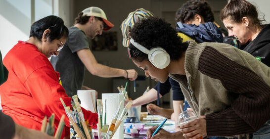 students engaging in collaborative painting
