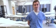medical student Michael Rockman standing in a lab.