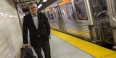 David Boardman standing next to a SEPTA subway train. 