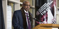 Former men's basketball Coach John Chaney standing at a podium.