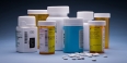 prescription medication bottles and pills.