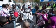 children smiling as they watch a robot at Temple Ambler EarthFest.