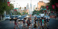 A group of student's crossing Broad Street on campus. 