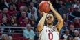 A Temple men's basketball player shooting a three-point shot.