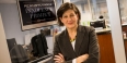 Marissa Bluestine standing in the Pennsylvania Innocence Project’s doorway.
