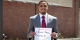 A man wearing a Temple “T” tie, standing in front of the engineering building.