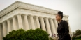  Temple graduate Jamira Burley standing in front of the Lincoln Memorial. 