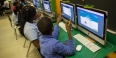 A boy and girl student working at a computer. 