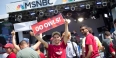 Temple students on an MSNBC set with banners and Temple t-shirts.