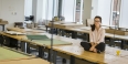Maryam Hallaj sitting on a studio table in the architecture building.