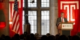 President Richard M. Englert standing at a podium and talking. 