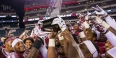 Temple’s football team holding the AAC East Conference Division title trophy. 