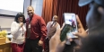  A student and an administrator getting their picture taken with a cell phone. 