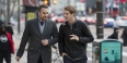 Justin Miller and Alex Cagle talking as they walk on Broad Street. 