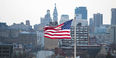American flag with Philadelphia skyline
