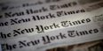 A spread of several New York Times newspapers.